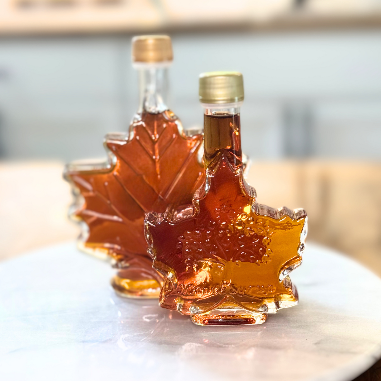 Maple Leaf shaped glass bottle filled with pure organic maple syrup from Graves Maple Products, Northern PA