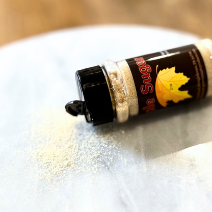 Maple sugar spilled from 2 oz shaker – Graves Maple Products on marble surface