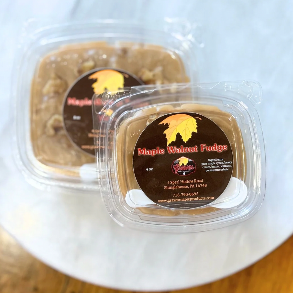 Two containers of Maple Walnut Fudge with a visible label on a white surface.