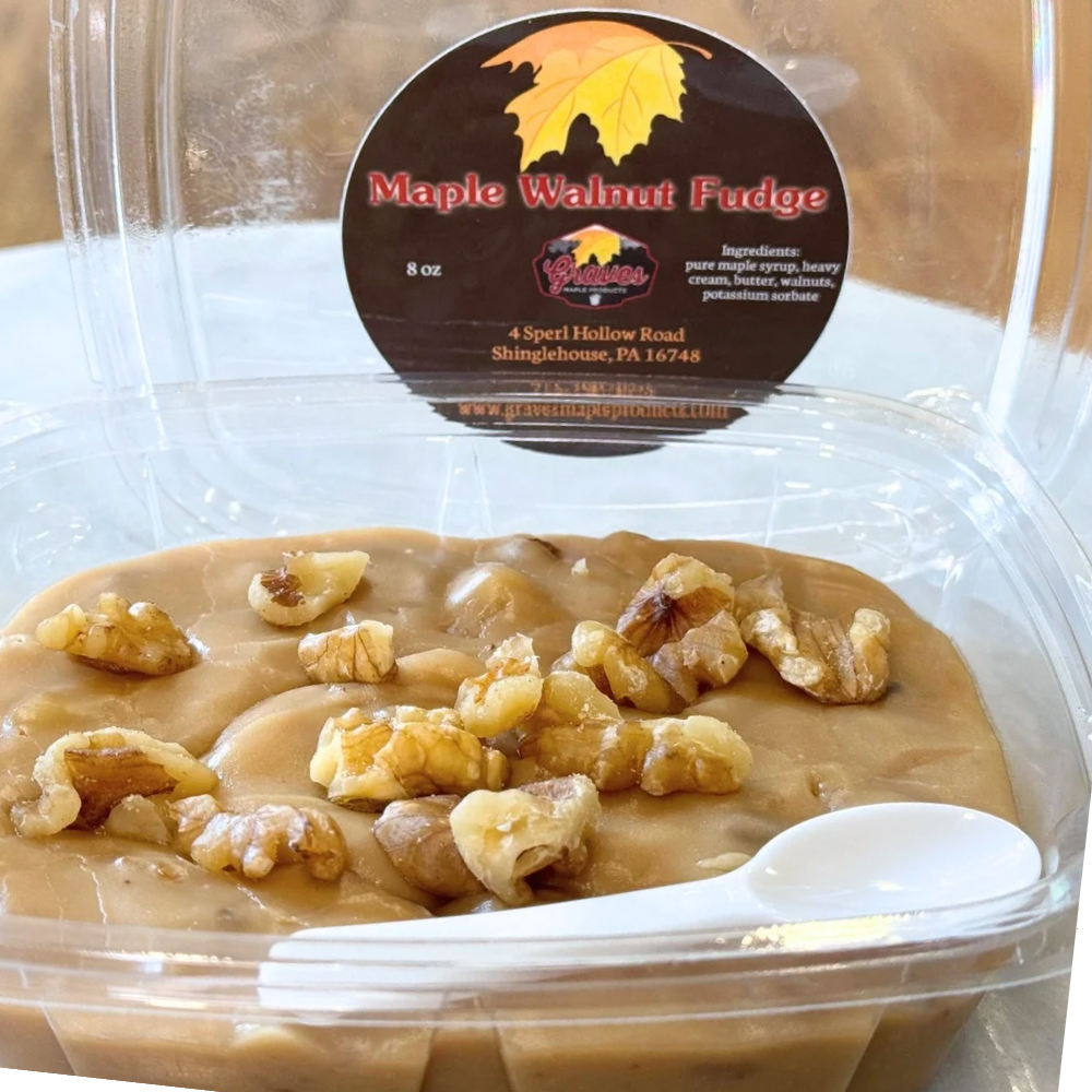 Container of Maple Walnut Fudge with a visible brand label on a white background