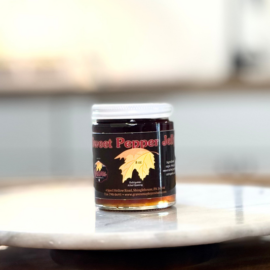 Sweet pepper jelly in jar on marble surface with blurred background – Graves Maple Products