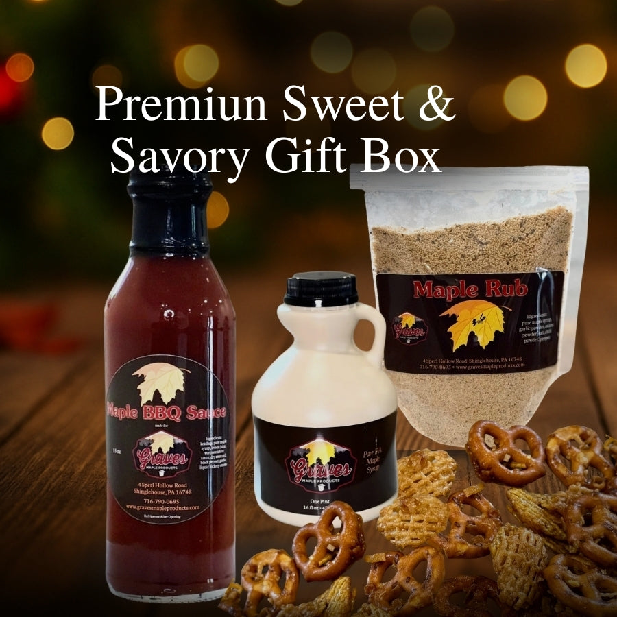 Maple syrup pint, maple BBQ sauce, maple rub, and maple crunch displayed on a rustic holiday background for the Graves Maple Products gift box.