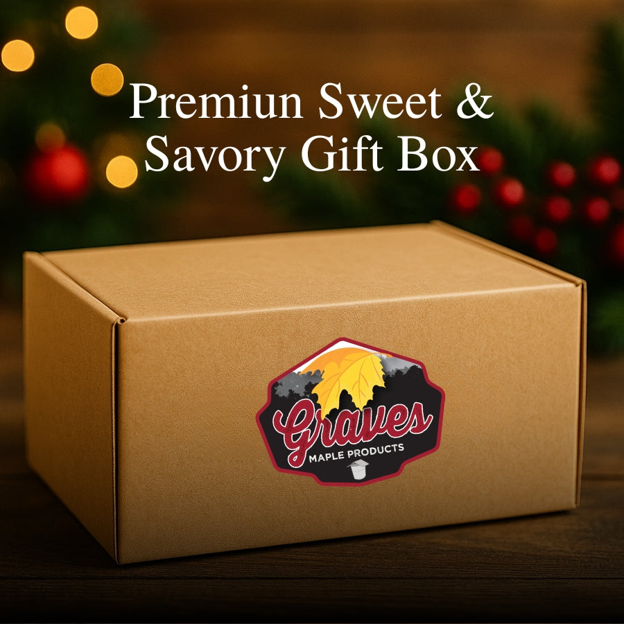 Large maple gift box with Graves Maple Products label on a holiday-themed rustic wood background.